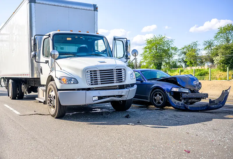 A truck and car in an accident